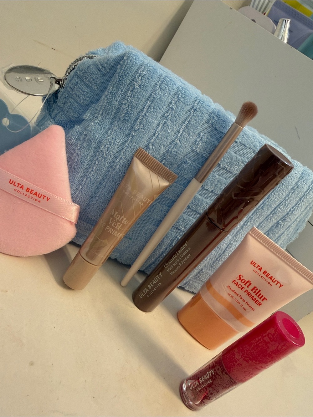 Ulta Beauty Light Blue Textured Cosmetic Pouch with Pink Sponge & Makeup